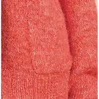 A close-up of a coral pink textured knit fabric, showing the detailed looped knit pattern and soft folds.