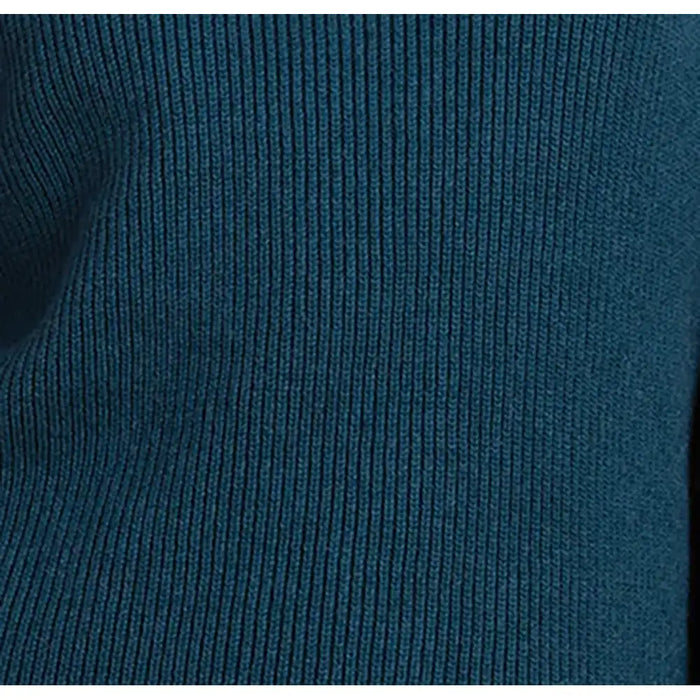 Close-up of a dark teal blue ribbed knit fabric texture.