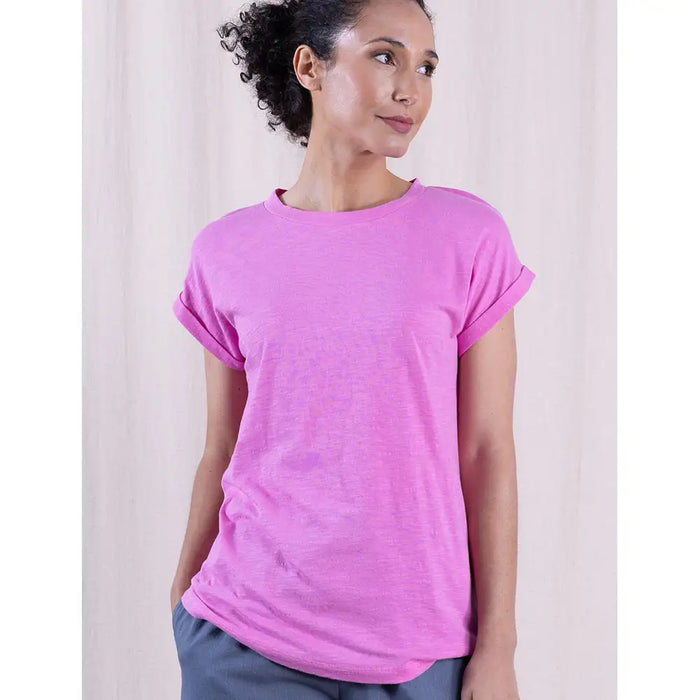Woman wearing a pink t-shirt against a plain background