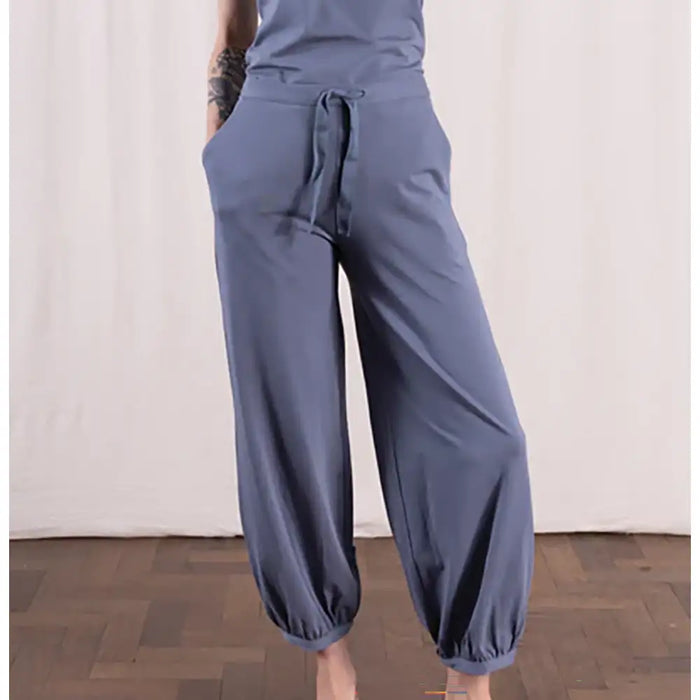 Blue wide-leg pants worn by a person on a plain background