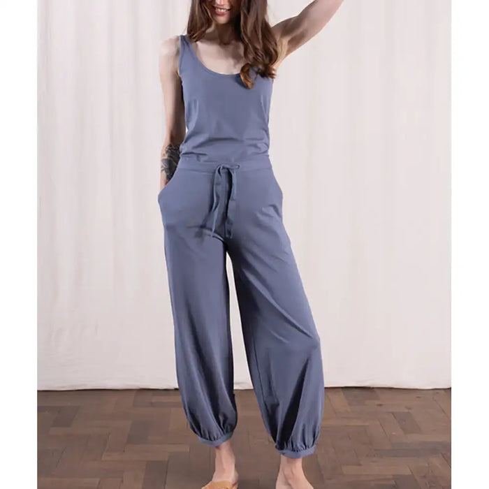 Person wearing a blue trousers against a white background