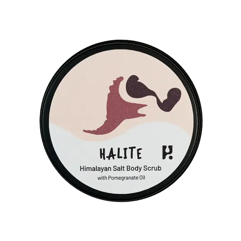 View of the lid of a tin of Halite Himalayan Salt body scrub. 