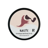 View of the lid of a tin of Halite Himalayan Salt body scrub. 
