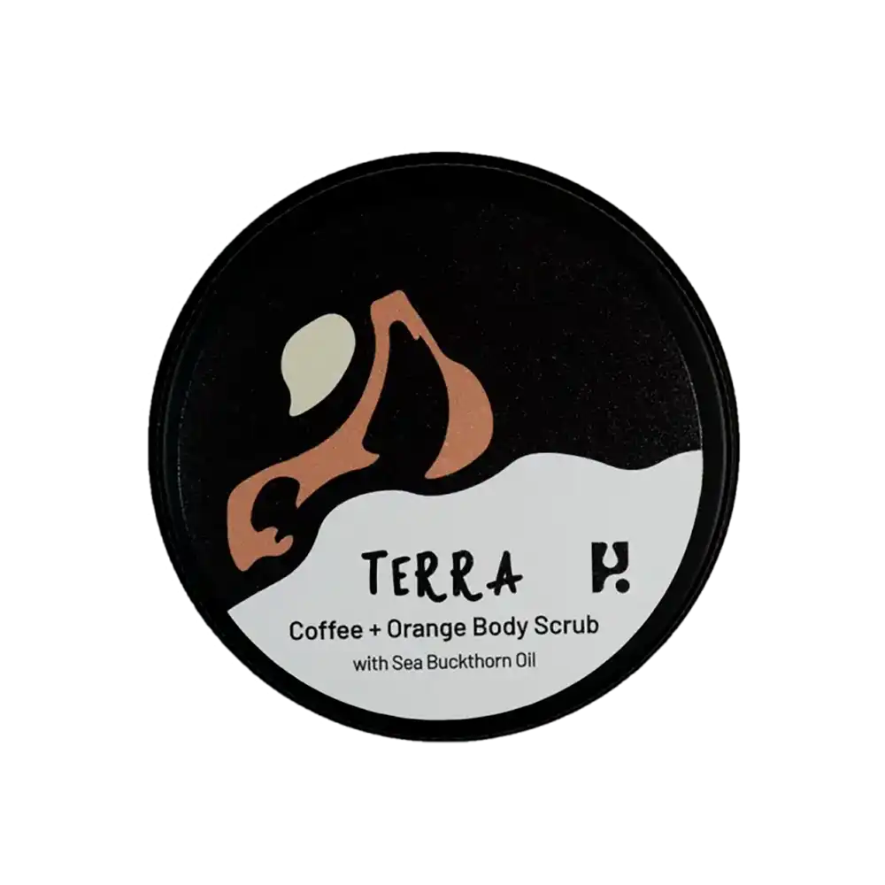 View of the lid of a tin of Terra Coffee and Orange Body Scrub with Sea Buckthorn Oil. 