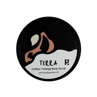 View of the lid of a tin of Terra Coffee and Orange Body Scrub with Sea Buckthorn Oil. 