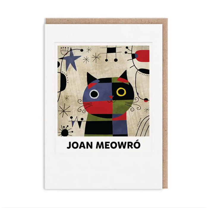 A greeting card featuring a colorful abstract cat illustration with the text 'JOAN MEOWRÓ' below, shown with a kraft paper envelope behind it on a white background.
