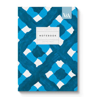 Notebook with blue and white geometric pattern on a white background