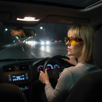 Woman driving a car wearing night sight glasses.