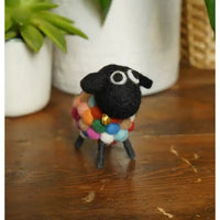 Felt sheep with a multicoloured bobbles body.