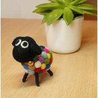 Felt sheep with a multicoloured bobbles body.