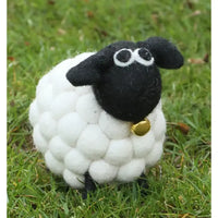 Felt sheep with a black face and bobbled white coat. Golden bell under chin.