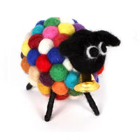Felt sheep with black face and large white eyes. Golden bell under chin. Body made up of multi coloured bobbles. 