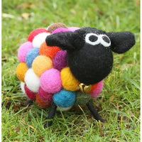 Felt sheep with black face and large white eyes. Golden bell under chin. Body made up of multi coloured bobbles. 