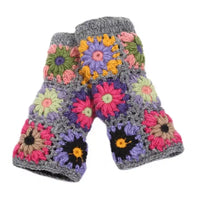 Colorful flower-patterned crochet gloves on a white background