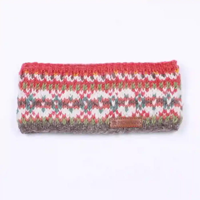 A knitted headband with a multicolor Fair Isle pattern of red, green, gray, and white, featuring a small brown leather brand patch on the front.