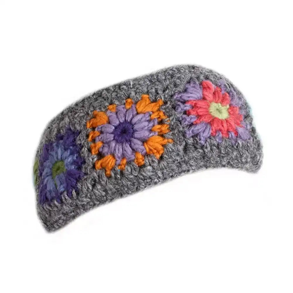 Gray knitted headband with colorful flower patterns on a white background