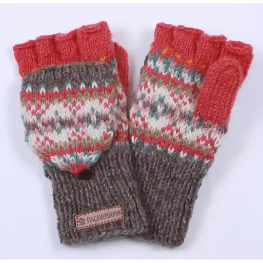 A pair of knit fingerless gloves with a multicolor Fair Isle pattern in red, green, and cream, featuring solid red cuff sections and a brown ribbed wristband with a small brand label.
