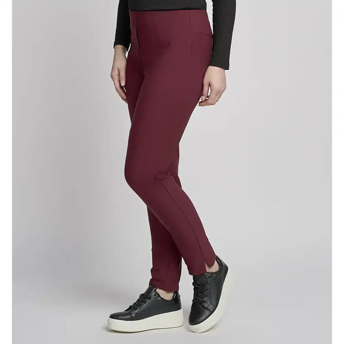 Maroon pants worn by a person on a plain background