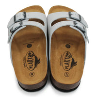 Pale grey sandals with brown soles on a white background