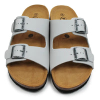 Pale grey sandals with brown soles on a white background