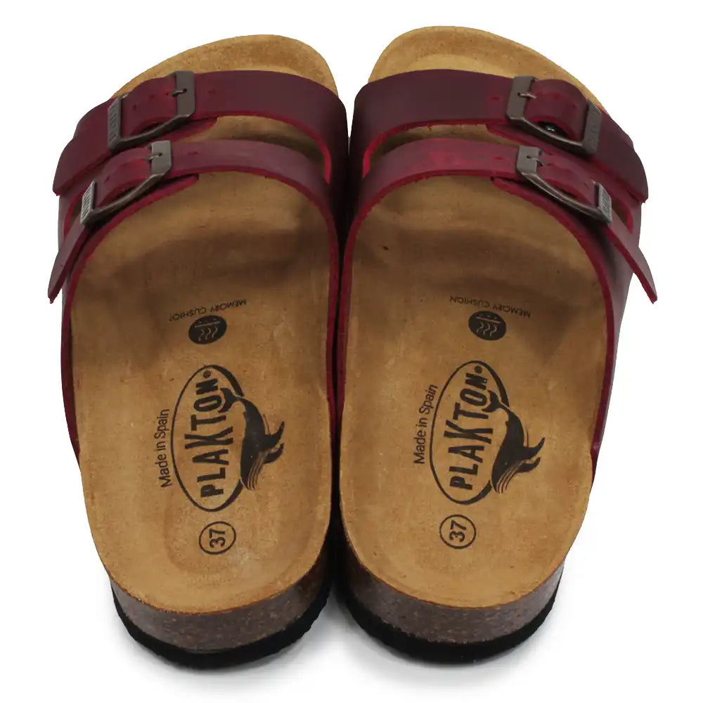 Pair of sandals with red straps and visible brand logo on a white background