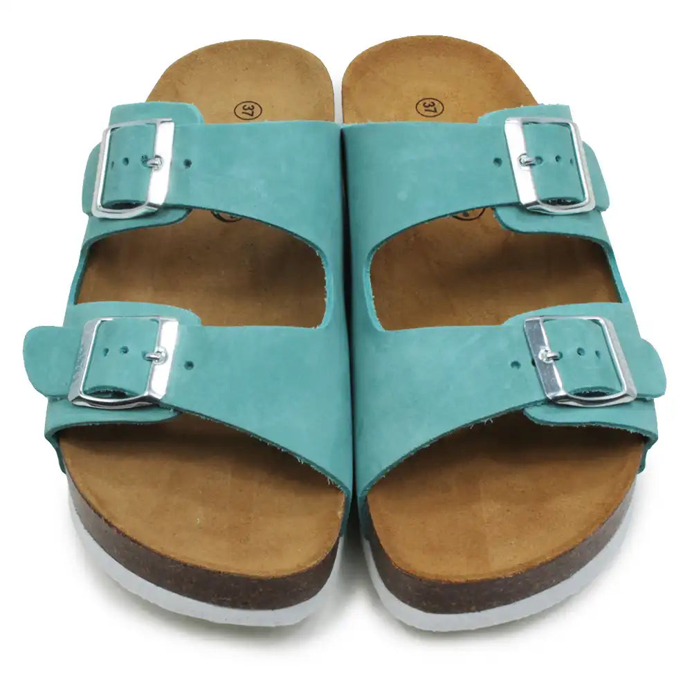 Teal double buckled sandals on a white background.