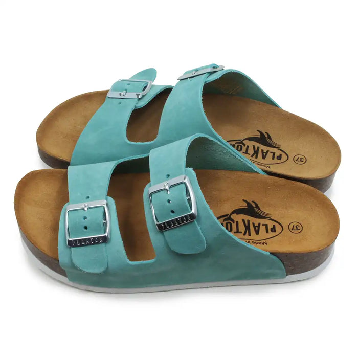Teal double buckled sandals on a white background.