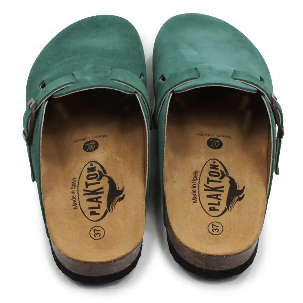 Pair of green clogs with visible Plakton branding on the soles.