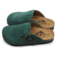 Pair of green suede clogs with wooden soles on a white background