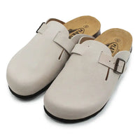 Beige open backed clogs on white background.