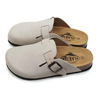 Beige open backed clogs on white background.