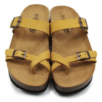 Mustard double buckled strappy sandals on a white background.