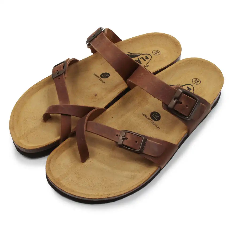 Brown buckled strappy sandals on white background.