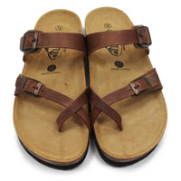 Brown buckled strappy sandals on white background.