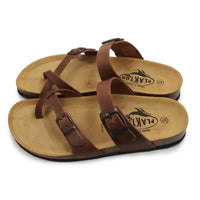 Brown buckled strappy sandals on white background.