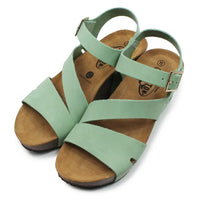 Light green strappy wedge sandals on a white background.