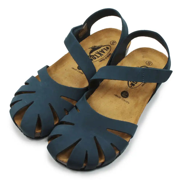 Pair of blue sandals with cut-out design on a white background