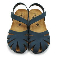 Pair of blue sandals with cut-out design on a white background