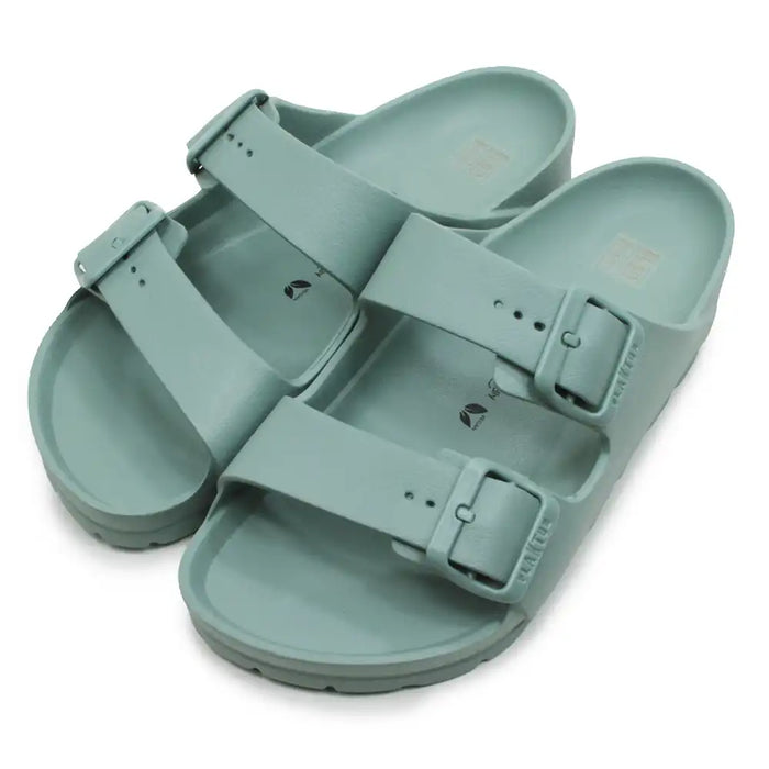 Green teal EVA waterproof double bucked sandals against a white background.