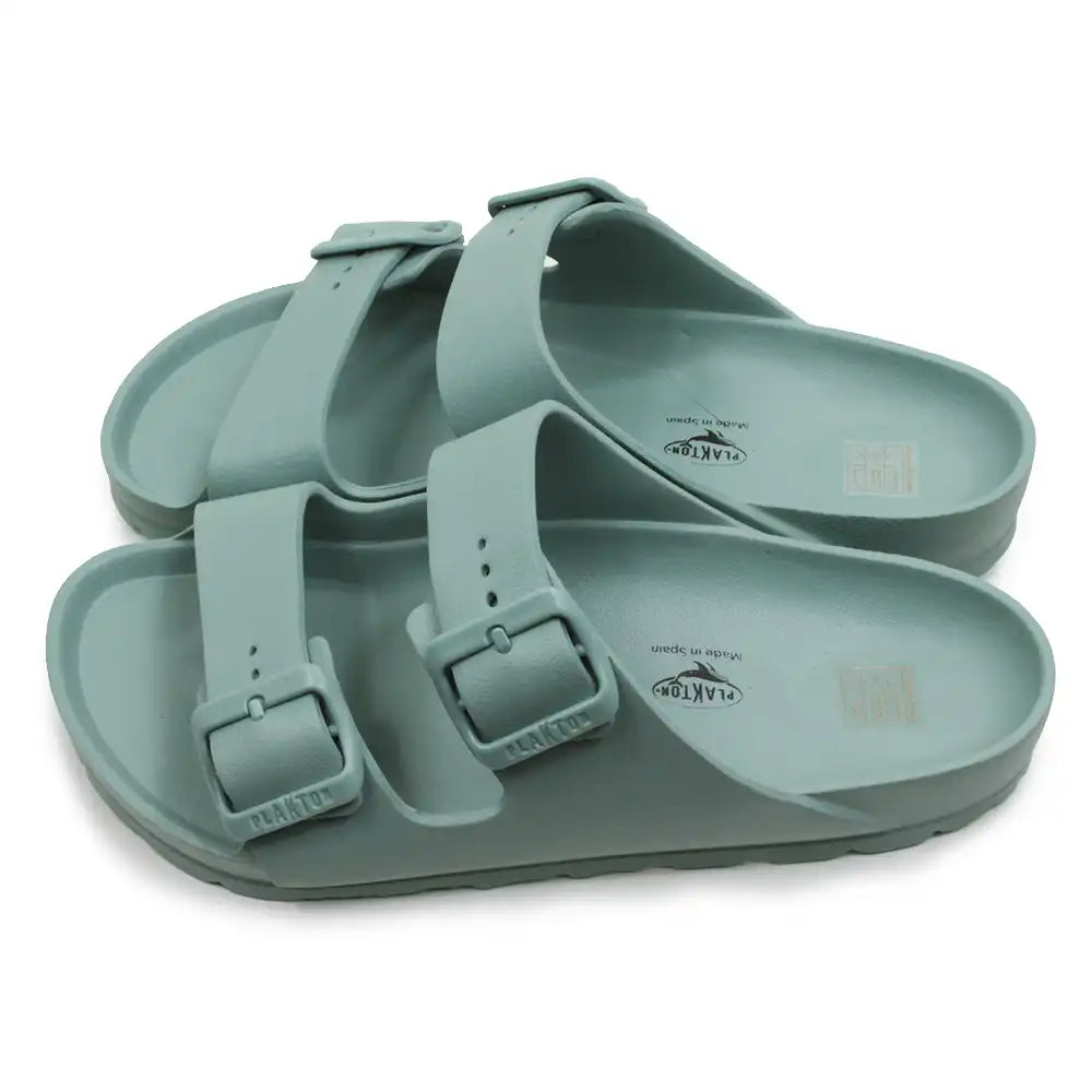 Green teal EVA waterproof double bucked sandals against a white background.