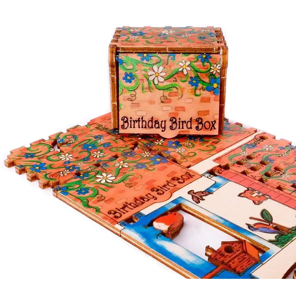 Decorative 'Birthday Bird Box' with floral patterns and a bird illustration on a white background