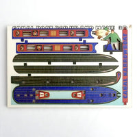A vintage paper model kit instruction sheet for building a canal boat, featuring colorful cut-out parts, a small cartoon figure, and text reading 'CANAL BOAT ROBUR AND MAKE BR' and 'CANAL JARROYS'.