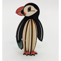 Wooden penguin figurine on a white background