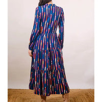 Multicolored striped dress on a plain background