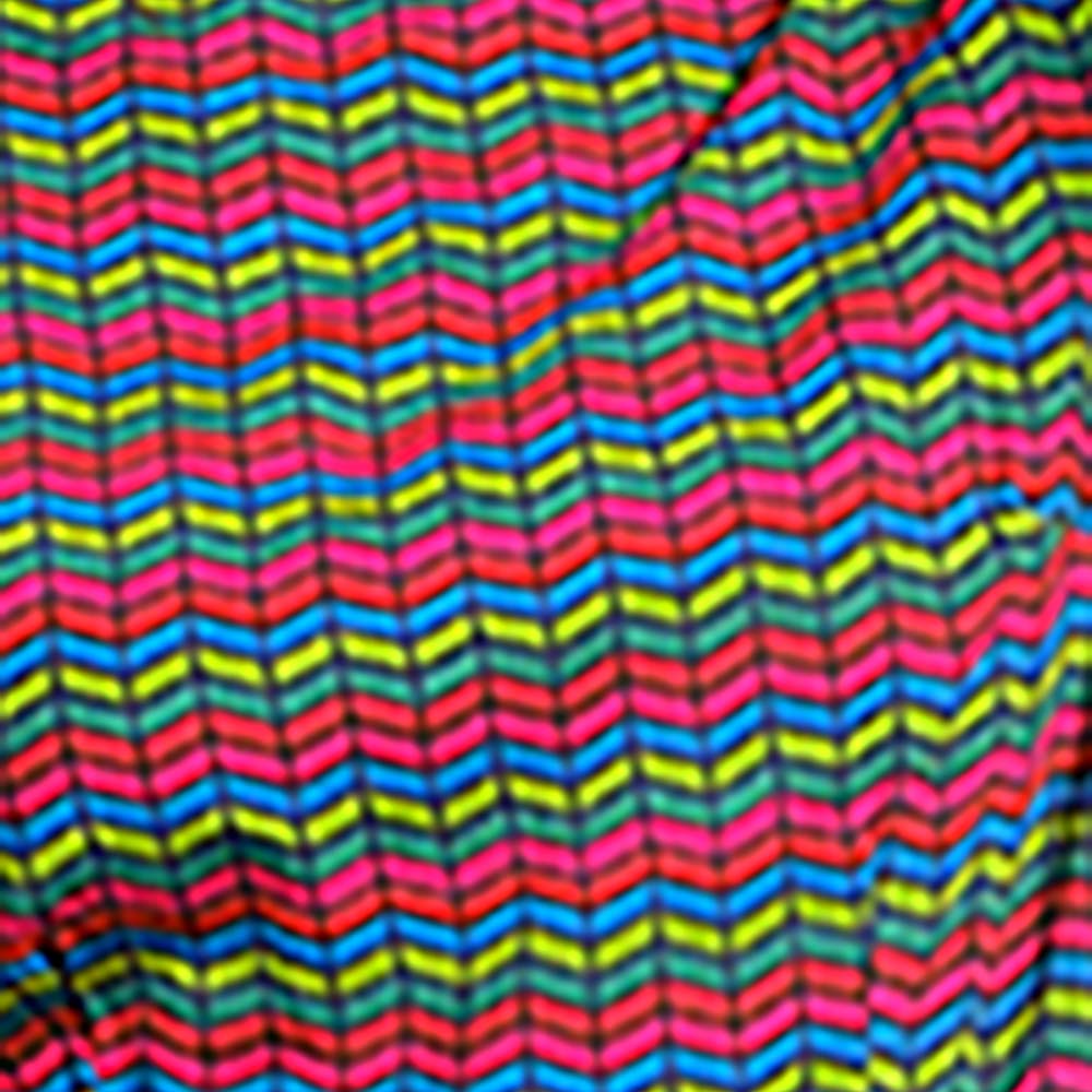 Pretty Vacant zig zag green and red arrow heads skater dress. Close up of pattern.