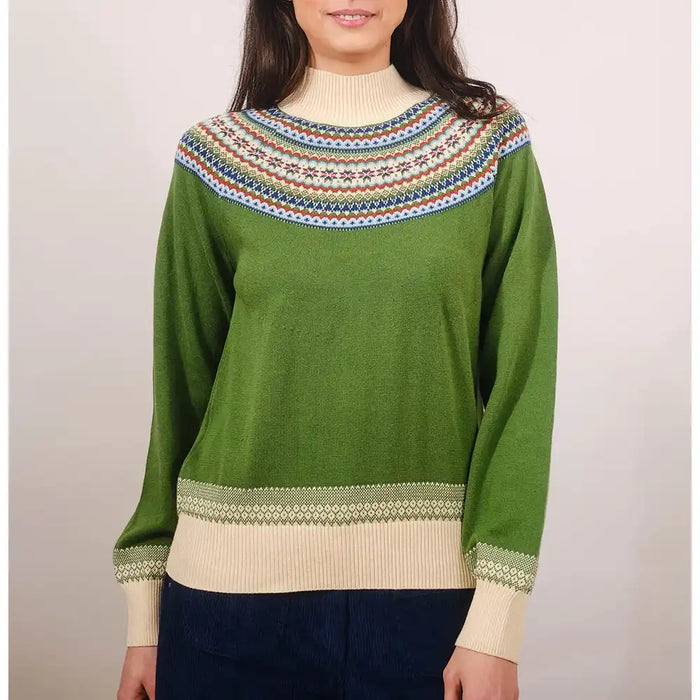 Green sweater with patterned collar and cuffs worn by a person on a plain background