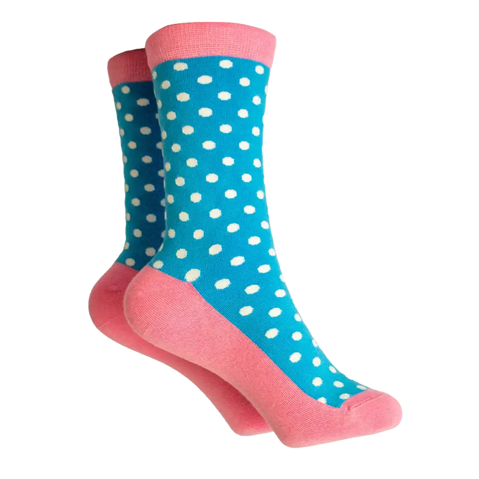 Blue and white polka dot socks with a coral ribbed ankle and coral coloured sole. 