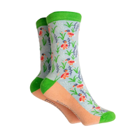 Grey based socks with green ankle hem, toe and heels. Coral coloured sole with ducks and reeds on the grey. 