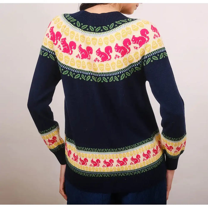 Navy sweater with colorful pattern on a plain background