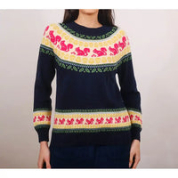 Navy sweater with colorful pattern on a plain background